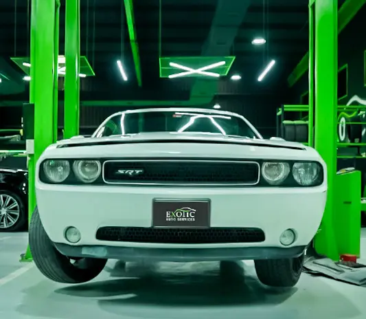 Dodge vehicle undergoing professional brake service at a modern workshop in Abu Dhabi.