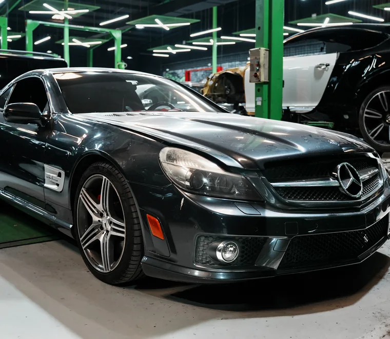 Dark Mercedes-Benz SL roadster in for service at the Exotic Auto Services workshop in Mussafah, Abu Dhabi.