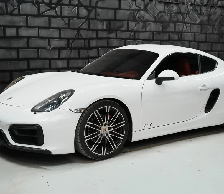White Porsche Cayman finished and ready for collection at Exotic Auto Services, Mussafah.