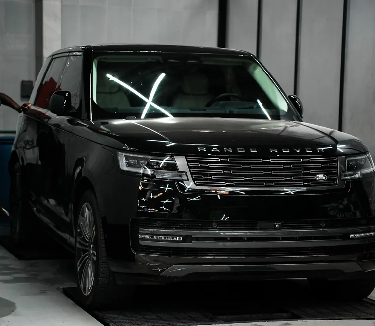 Black Range Rover masked and prepared for body and paint work at Exotic Auto Services, Abu Dhabi.