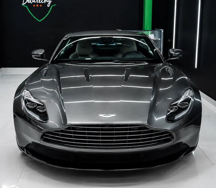 Silver Aston Martin DB11 photographed head-on after service at Exotic Auto Services, Abu Dhabi.