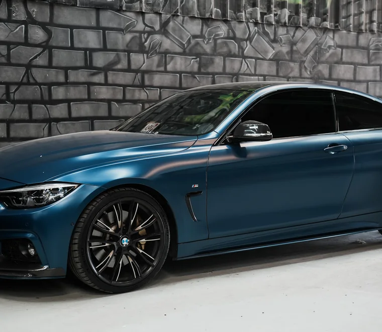 Frozen blue BMW 4 Series coupe finished and ready for collection at Exotic Auto Services, Abu Dhabi.