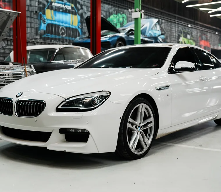 White BMW 6 Series Gran Coupe in for service at the Exotic Auto Services workshop in Mussafah, Abu Dhabi.