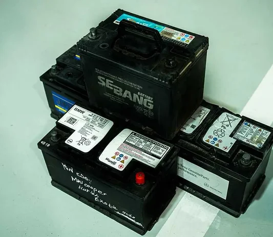 Car battery being replaced at the Exotic Auto Services workshop in Mussafah, Abu Dhabi