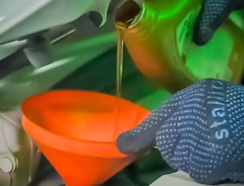 Engine oil being changed during a minor car service at the Exotic Auto Services workshop in Mussafah, Abu Dhabi