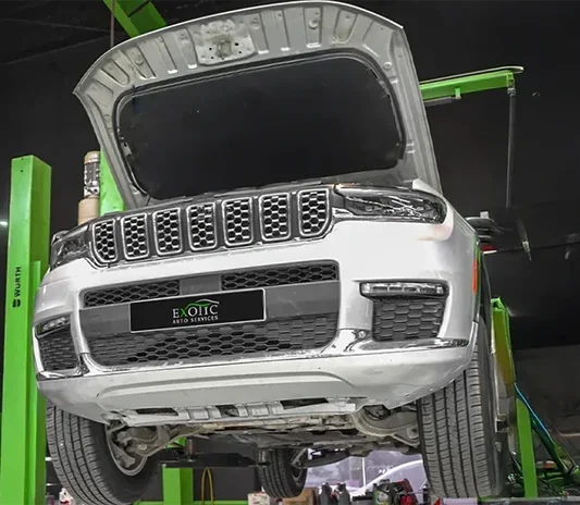 Jeep Grand Cherokee on a ramp during a service at the Exotic Auto Services workshop in Mussafah, Abu Dhabi