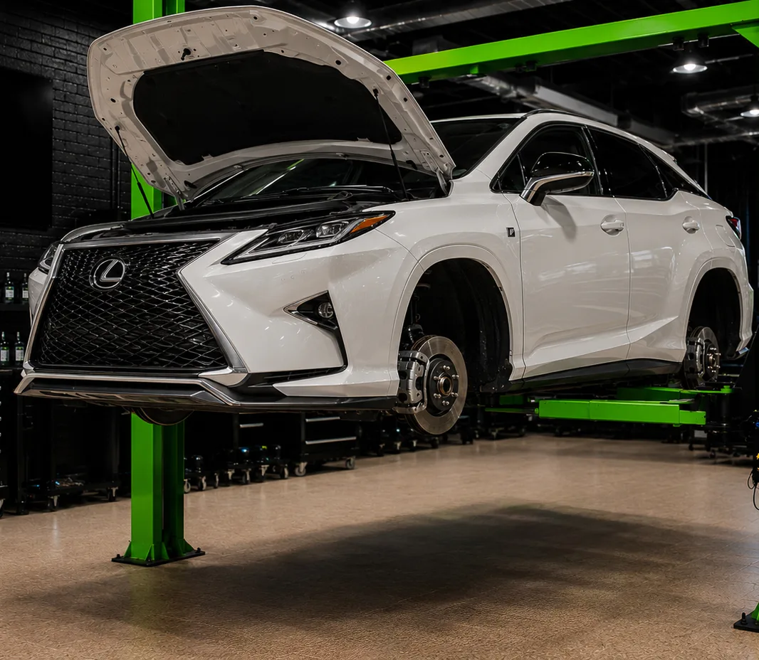 Lexus raised on the two-post lift at the Exotic Auto Services workshop in Mussafah