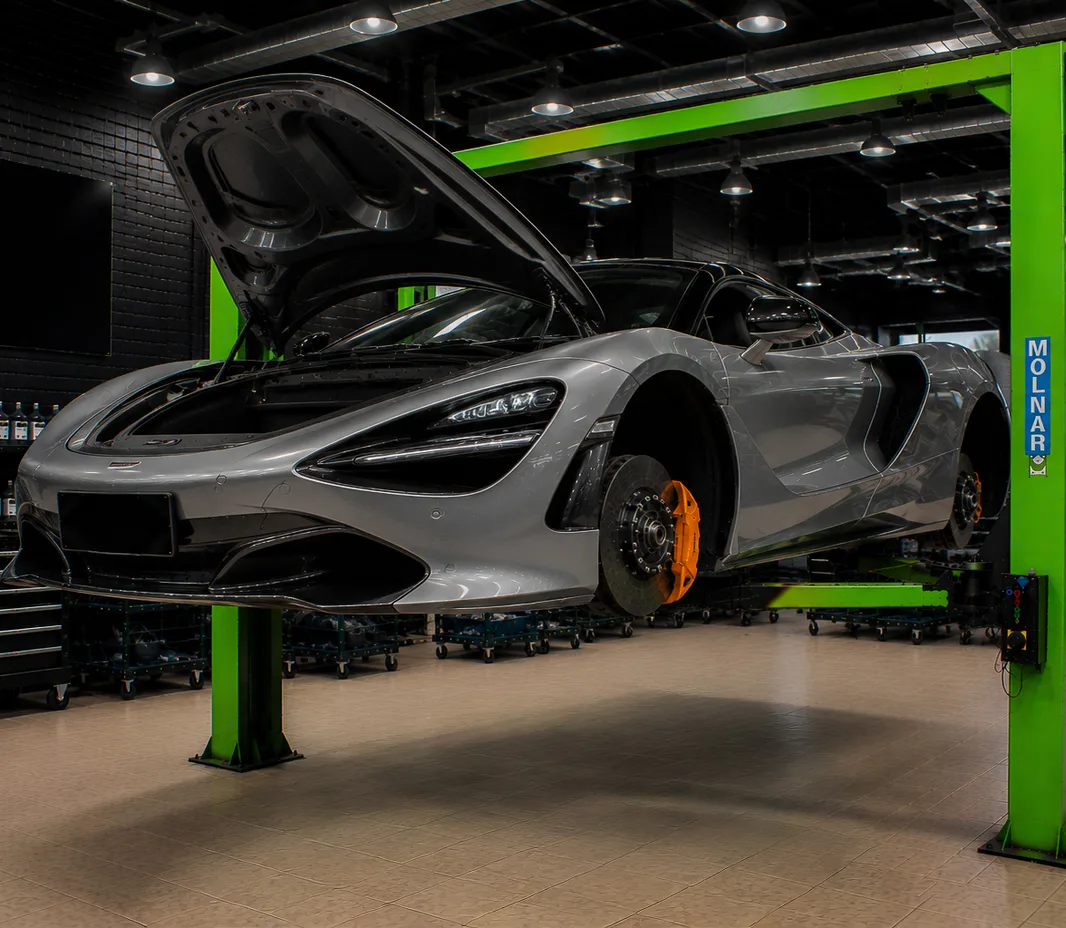McLaren raised on the two-post lift at the Exotic Auto Services workshop in Mussafah