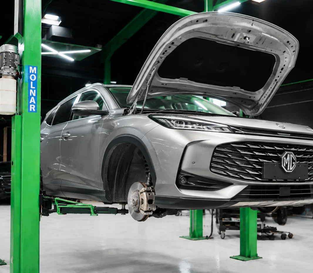MG raised on the two-post lift at the Exotic Auto Services workshop in Mussafah