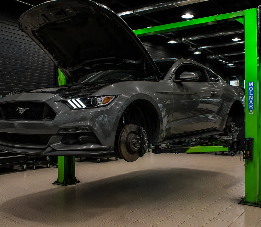 Mustang with the bonnet open for engine bay inspection in Mussafah, Abu Dhabi