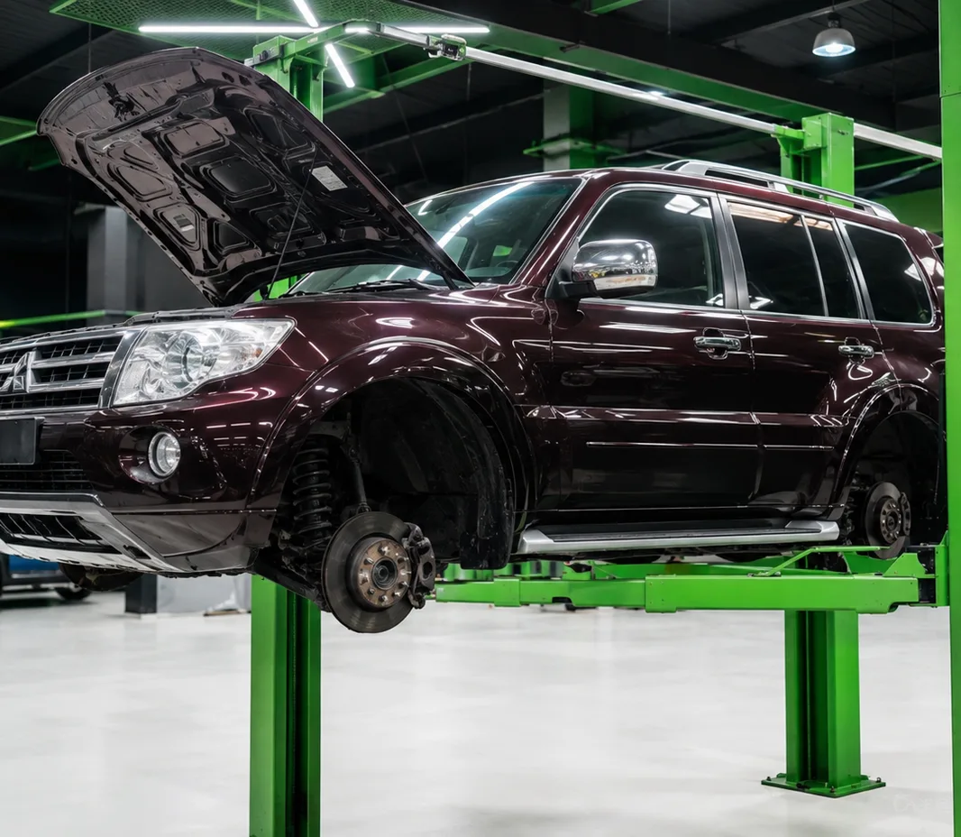Pajero with the bonnet open for engine bay inspection in Mussafah, Abu Dhabi