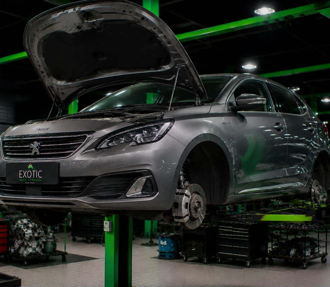 Peugeot with the bonnet open for engine bay inspection in Mussafah, Abu Dhabi