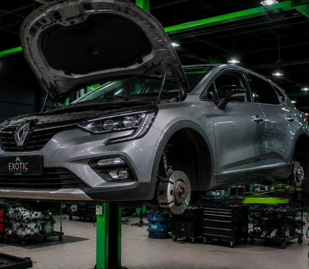 Renault with the bonnet open for engine bay inspection in Mussafah, Abu Dhabi