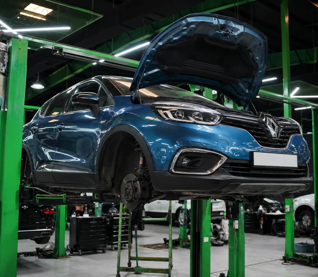 Renault raised on the two-post lift at the Exotic Auto Services workshop in Mussafah
