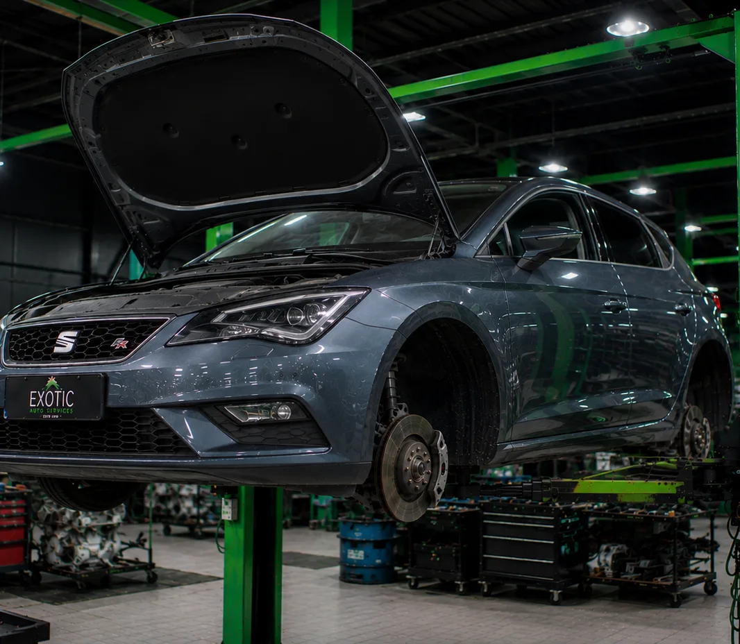 SEAT raised on the two-post lift at the Exotic Auto Services workshop in Mussafah