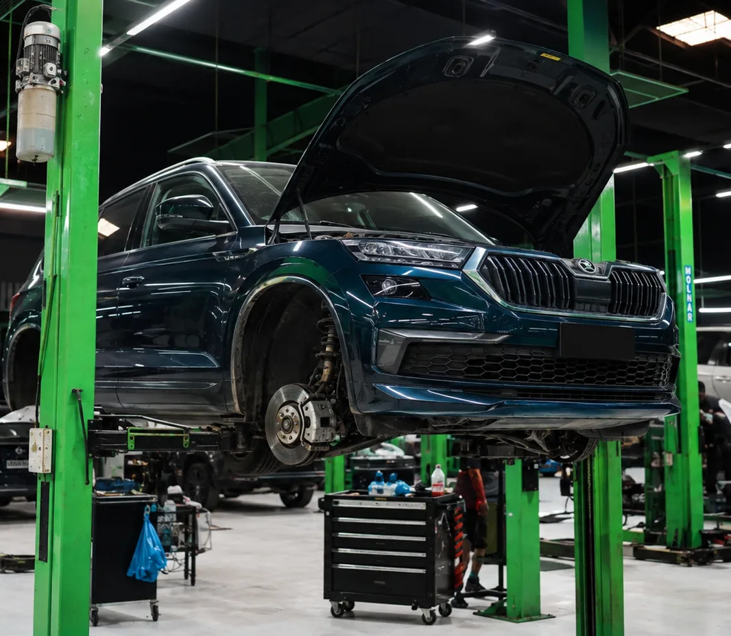 Skoda raised on the two-post lift at the Exotic Auto Services workshop in Mussafah