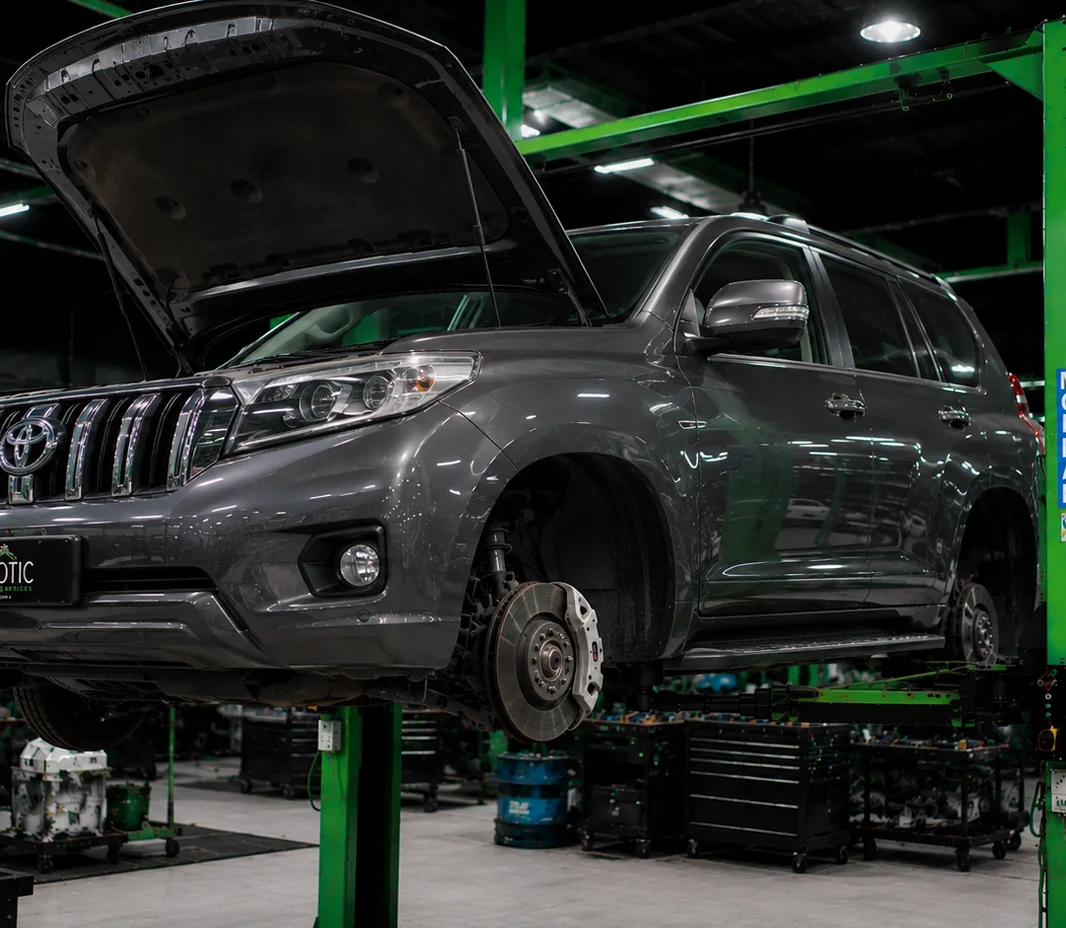 Toyota raised on the two-post lift at the Exotic Auto Services workshop in Mussafah