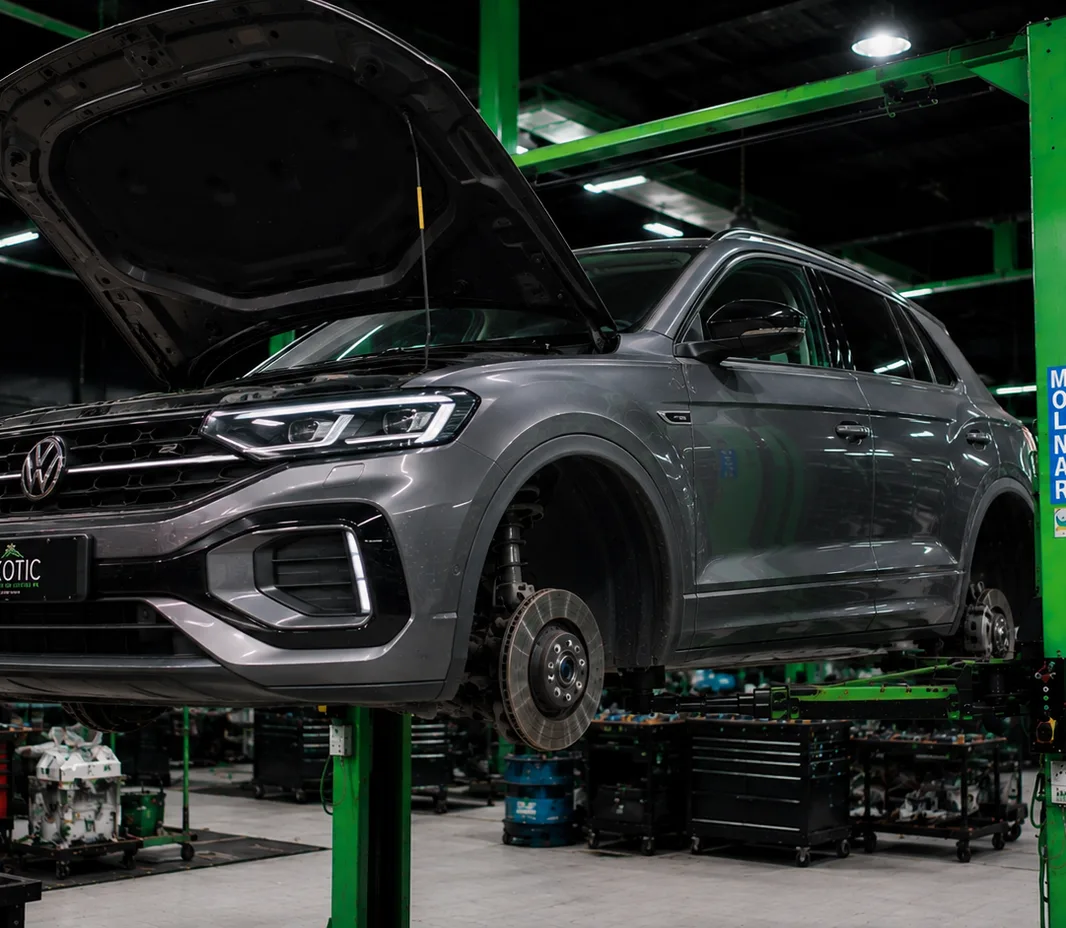 Volkswagen with the bonnet open for engine bay inspection in Mussafah, Abu Dhabi