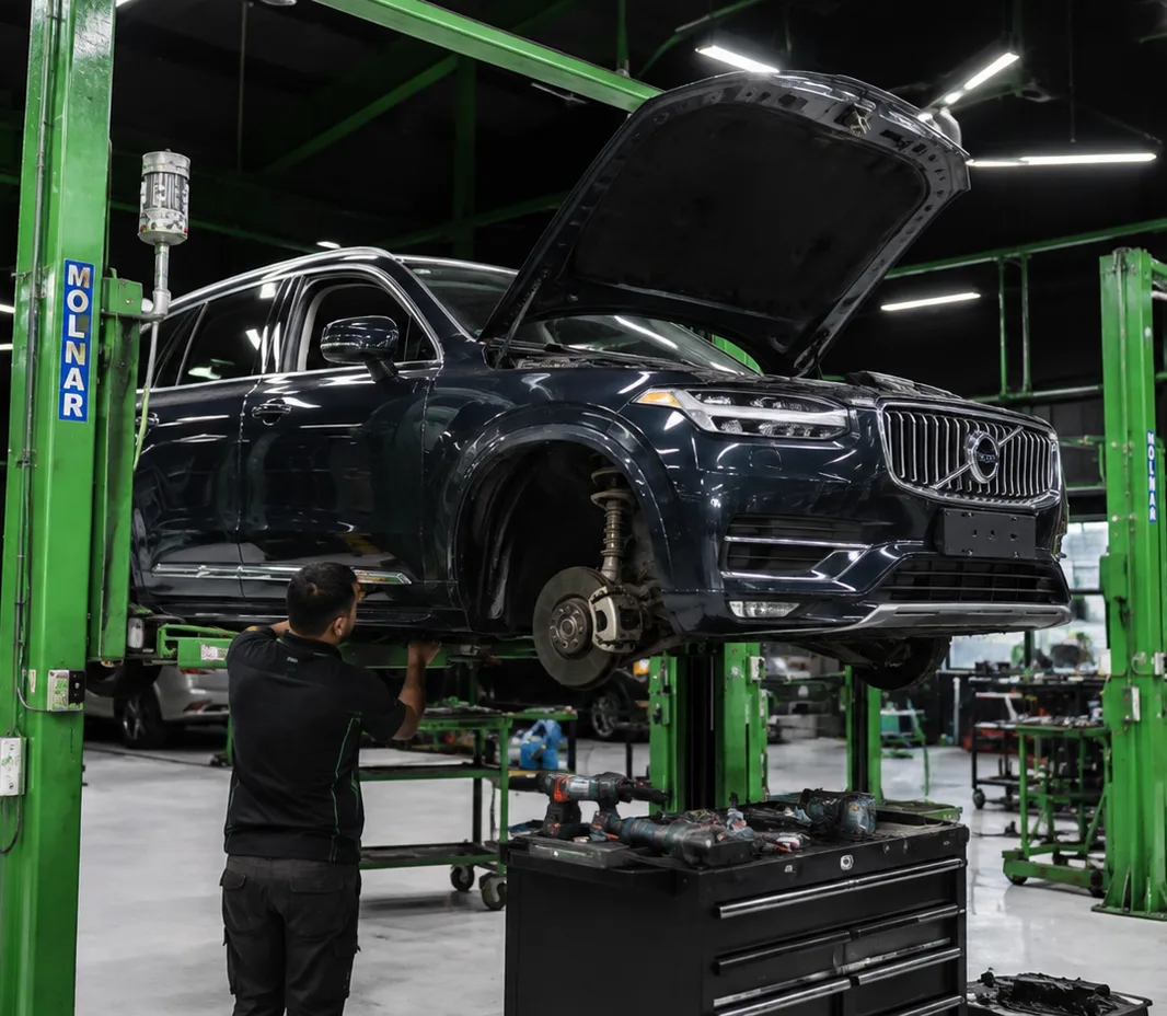 Volvo with the wheels off for brake service at the Mussafah workshop