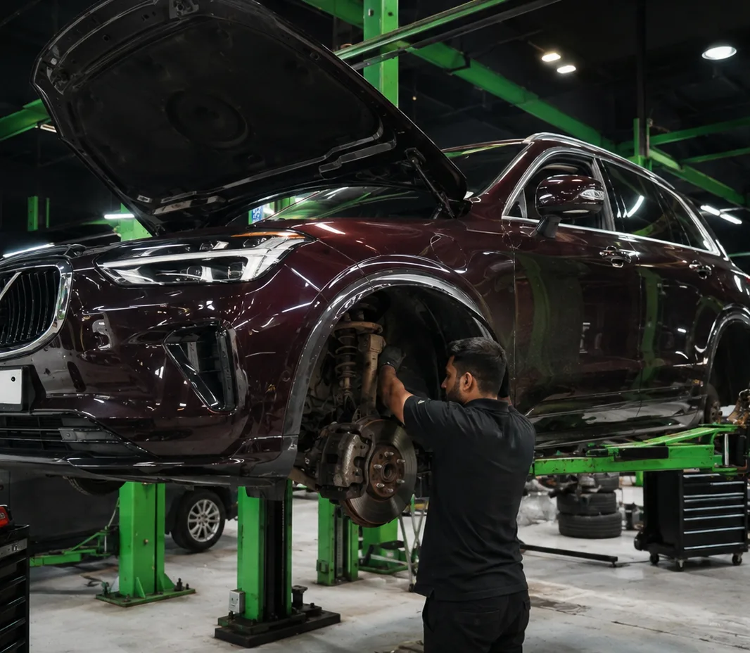Volvo raised on the two-post lift at the Exotic Auto Services workshop in Mussafah
